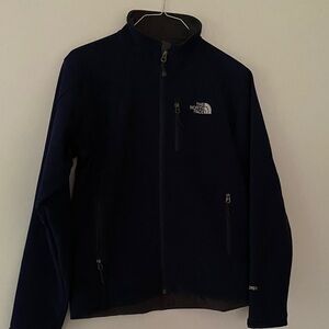 The North Face Men's Navy Size S Jacket.  Excellent condition!  Sharp!